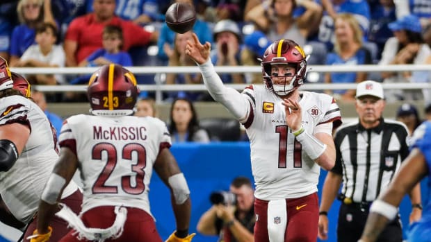 Commanders quarterback Carson Wentz throws to J.D. McKissic.